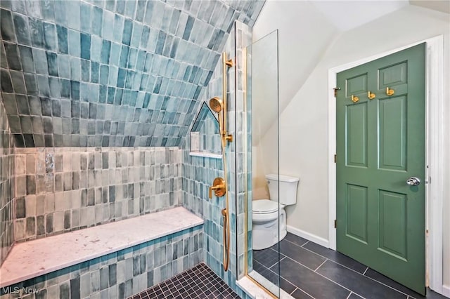899 Park Blvd W, East Liverpool, OH 43920 - bathroom with vaulted ceiling, tile patterned flooring, a tile shower, toilet, and baseboards