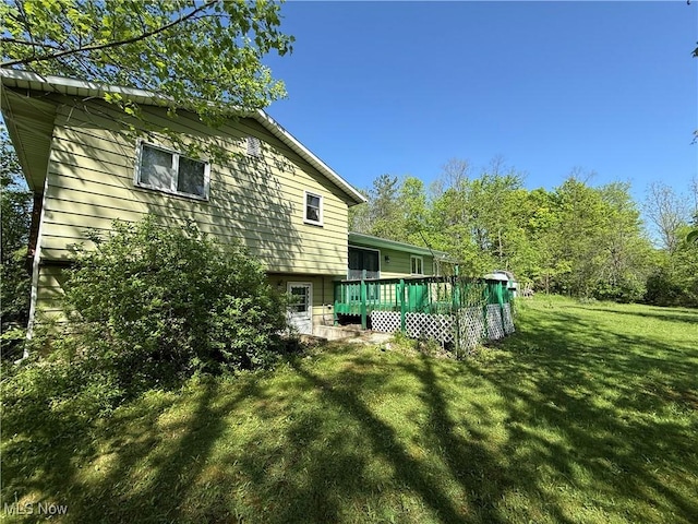 6855 Painesville Ravenna Rd, Concord, OH 44077 - view of green lawn featuring a wooden deck