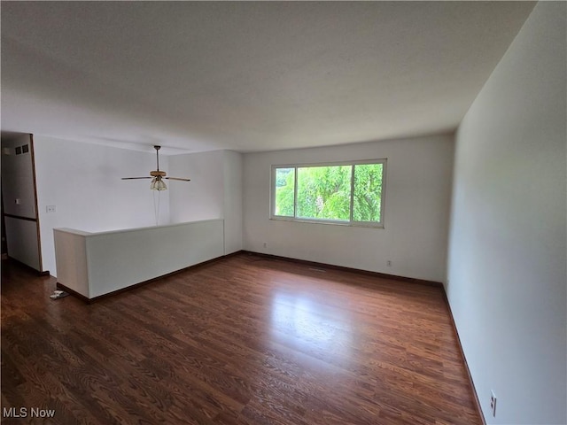 1308 17th St, Vienna, WV 26105 - unfurnished room featuring dark wood-style floors, baseboards, and ceiling fan