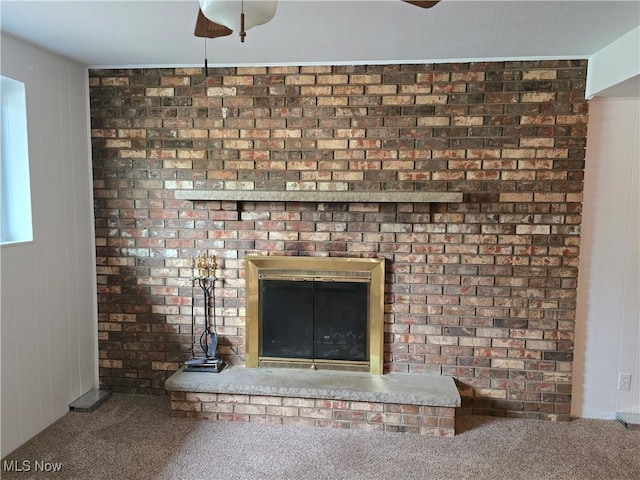 1308 17th St, Vienna, WV 26105 - detailed view of a fireplace, carpet, and a ceiling fan