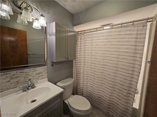 1308 17th St, Vienna, WV 26105 - full bathroom featuring tasteful backsplash, toilet, vanity, and a shower with curtain