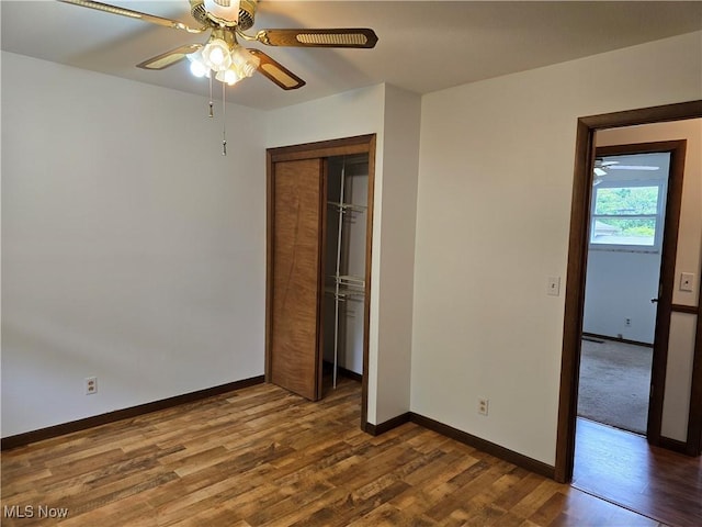 1308 17th St, Vienna, WV 26105 - unfurnished bedroom with dark wood-style flooring, baseboards, a closet, and ceiling fan