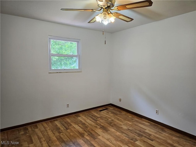 1308 17th St, Vienna, WV 26105 - spare room with a ceiling fan, wood finished floors, and baseboards
