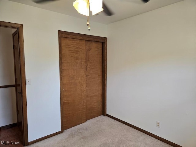 1308 17th St, Vienna, WV 26105 - unfurnished bedroom with a closet, light carpet, a ceiling fan, and baseboards