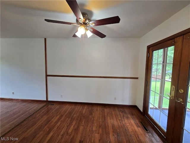 1308 17th St, Vienna, WV 26105 - unfurnished room with dark wood-type flooring, plenty of natural light, ceiling fan, and baseboards