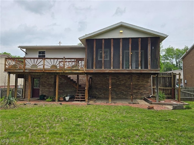 1308 17th St, Vienna, WV 26105 - back of property with a sunroom, a deck, brick siding, and stairs