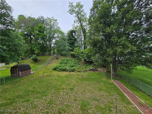 1308 17th St, Vienna, WV 26105 - view of yard featuring an outdoor structure and a storage shed
