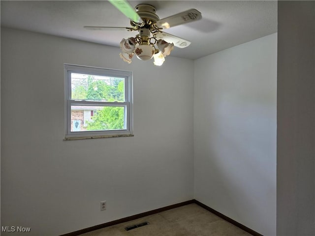 1308 17th St, Vienna, WV 26105 - spare room with light colored carpet, a ceiling fan, and baseboards