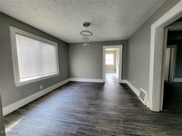 432 Fuller St, Akron, OH 44306 - unfurnished room with dark wood-type flooring, baseboards, and a textured ceiling