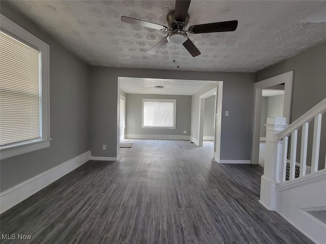 432 Fuller St, Akron, OH 44306 - unfurnished room with dark wood-type flooring, baseboards, a ceiling fan, and a textured ceiling