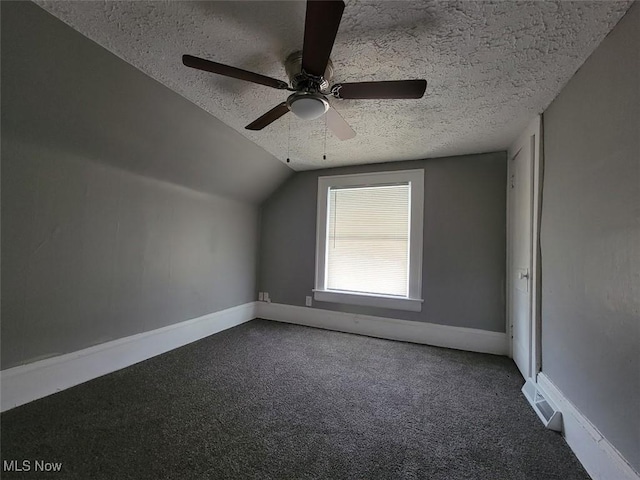 432 Fuller St, Akron, OH 44306 - additional living space with a textured ceiling, carpet flooring, baseboards, lofted ceiling, and ceiling fan