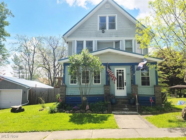 american foursquare style home with entry steps and a garage