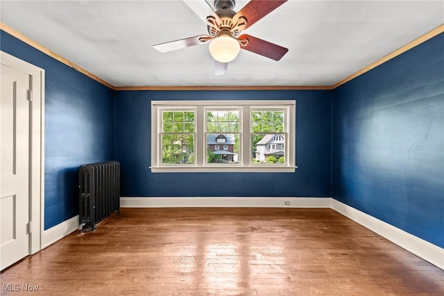 3004 Essex Rd, Cleveland Heights, OH 44118 - empty room with radiator heating unit, hardwood / wood-style flooring, ceiling fan, crown molding, and baseboards