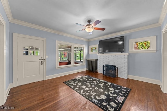 3004 Essex Rd, Cleveland Heights, OH 44118 - living room with a ceiling fan, a brick fireplace, wood finished floors, crown molding, and baseboards