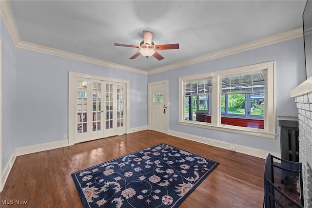 3004 Essex Rd, Cleveland Heights, OH 44118 - entrance foyer with ceiling fan, wood finished floors, baseboards, ornamental molding, and a fireplace