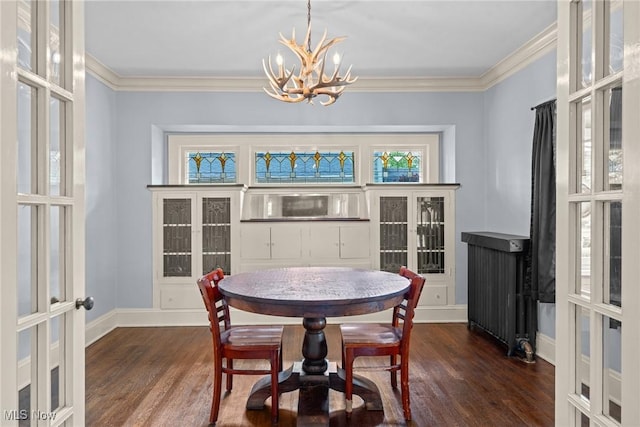 3004 Essex Rd, Cleveland Heights, OH 44118 - dining space with a chandelier, dark wood finished floors, french doors, ornamental molding, and baseboards