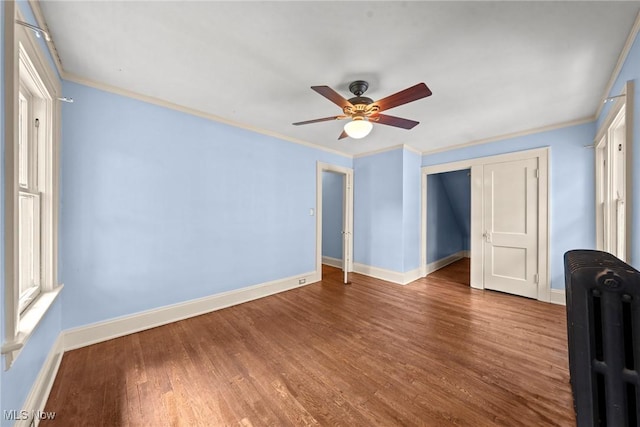 3004 Essex Rd, Cleveland Heights, OH 44118 - empty room with ceiling fan, wood finished floors, baseboards, and crown molding