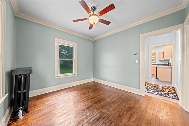 3004 Essex Rd, Cleveland Heights, OH 44118 - spare room featuring hardwood / wood-style flooring, ceiling fan, crown molding, and baseboards