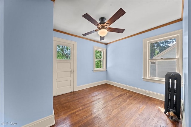 3004 Essex Rd, Cleveland Heights, OH 44118 - unfurnished room featuring crown molding, wood-type flooring, baseboards, and a ceiling fan