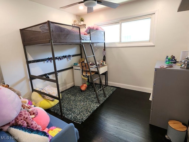 bedroom featuring dark wood-type flooring and baseboards