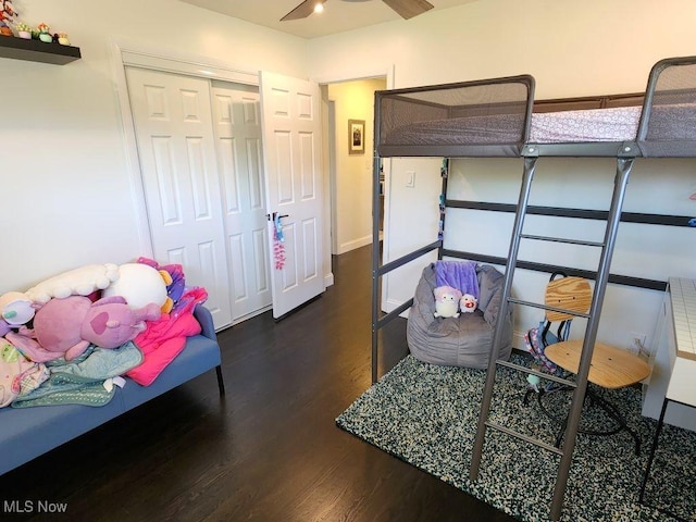 bedroom featuring wood finished floors and a closet