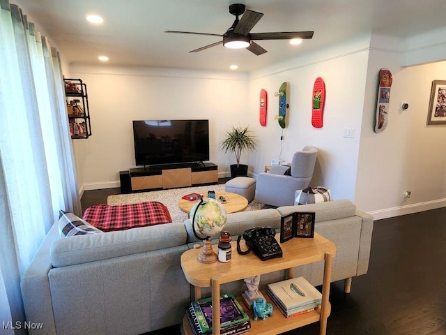 living area with a ceiling fan, baseboards, recessed lighting, and wood finished floors