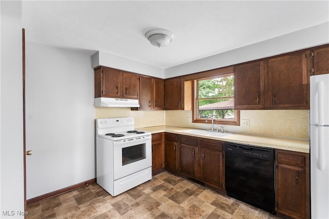 kitchen featuring white appliances, under cabinet range hood, a sink, backsplash, and light countertops