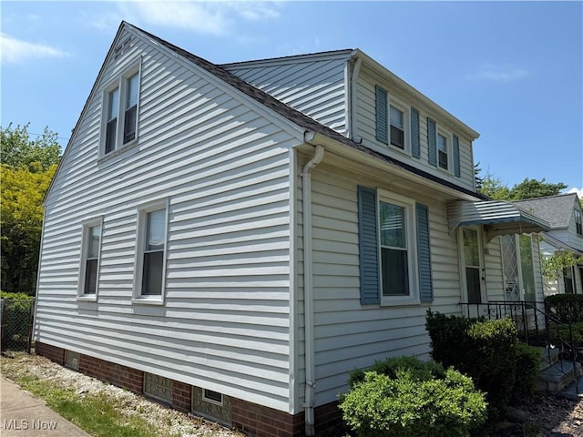 view of side of home with crawl space