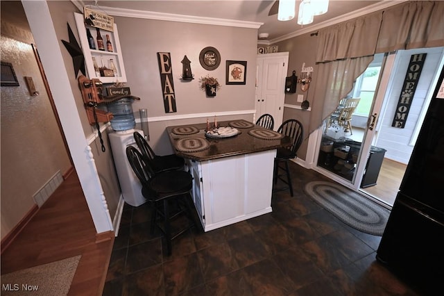 50277 Carroll Rd, East Liverpool, OH 43920 - dining room with ornamental molding, ceiling fan, and baseboards