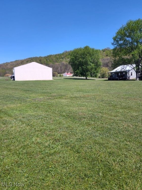 297 Hales Lndg, Elizabeth, WV 26143 - view of grassy yard featuring an outbuilding and an outdoor structure
