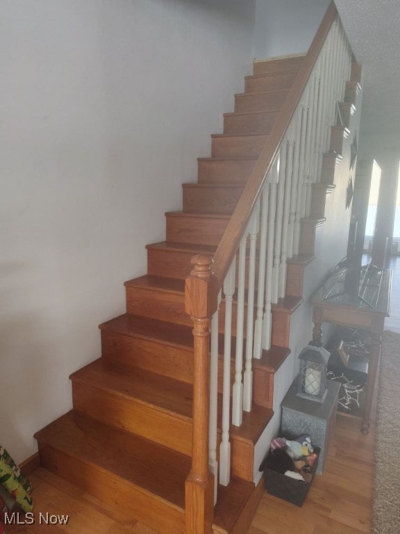 297 Hales Lndg, Elizabeth, WV 26143 - stairs with wood finished floors