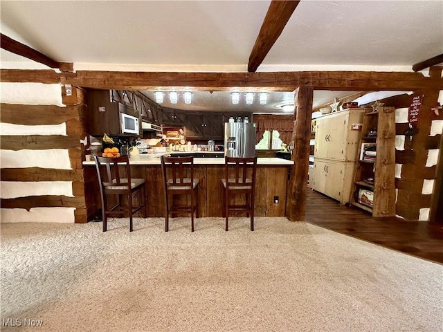 6141 Avon Rd NE, Carrollton, OH 44615 - kitchen featuring light colored carpet, stainless steel refrigerator with ice dispenser, light countertops, a peninsula, and a breakfast bar