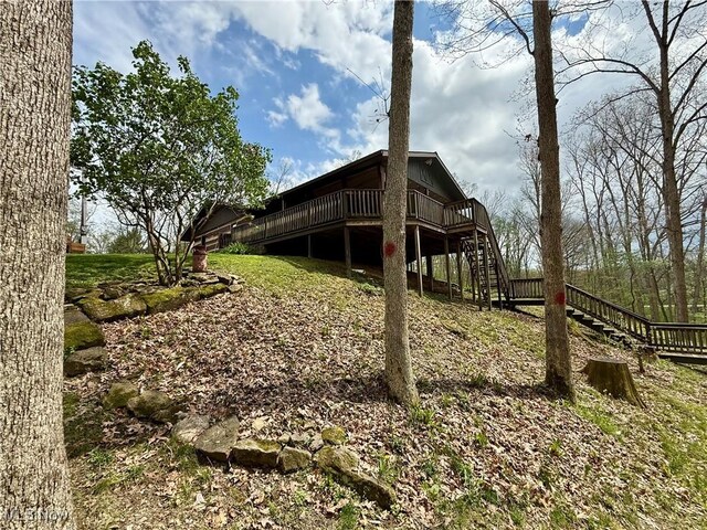 6141 Avon Rd NE, Carrollton, OH 44615 - view of side of property featuring stairway and a wooden deck