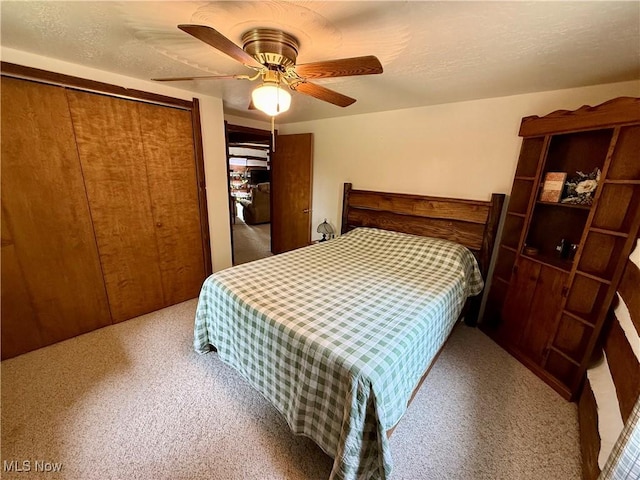 6141 Avon Rd NE, Carrollton, OH 44615 - bedroom featuring carpet floors, a closet, and a ceiling fan