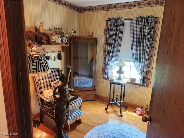 867 S 14th St, Sebring, OH 44672 - living area with wood finished floors, baseboards, and wallpapered walls