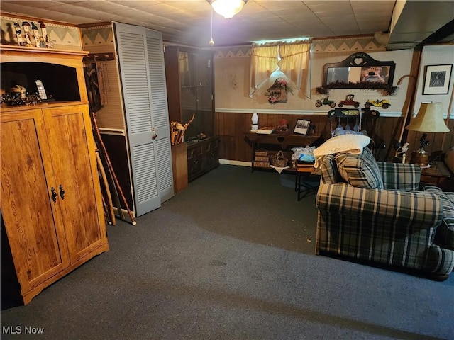 867 S 14th St, Sebring, OH 44672 - carpeted living area featuring wooden walls