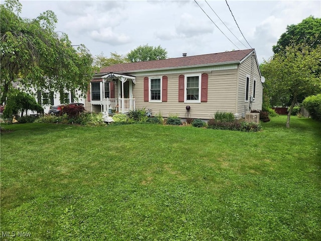867 S 14th St, Sebring, OH 44672 - view of front of home with a front lawn and central AC