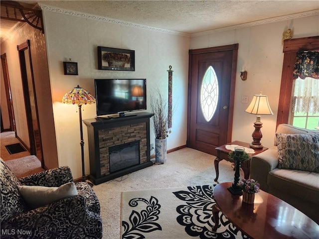 867 S 14th St, Sebring, OH 44672 - living room featuring light colored carpet, a textured ceiling, a stone fireplace, baseboards, and ornamental molding
