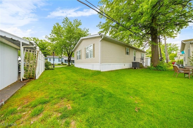 8 Maple Dr, Olmsted Twp, OH 44138 - view of grassy yard featuring central AC unit