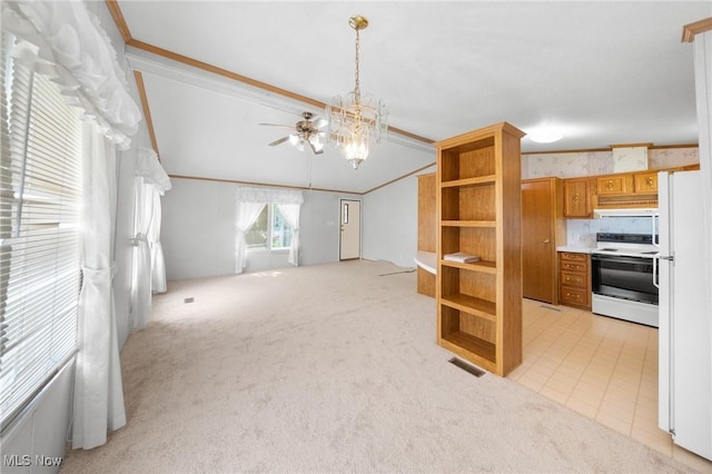 8 Maple Dr, Olmsted Twp, OH 44138 - unfurnished living room featuring light colored carpet, vaulted ceiling, ceiling fan, crown molding, and a chandelier