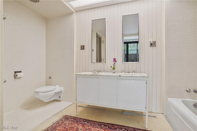 3210 N Dover Rd, Silver Lake, OH 44224 - full bathroom with a bathtub, toilet, and double vanity