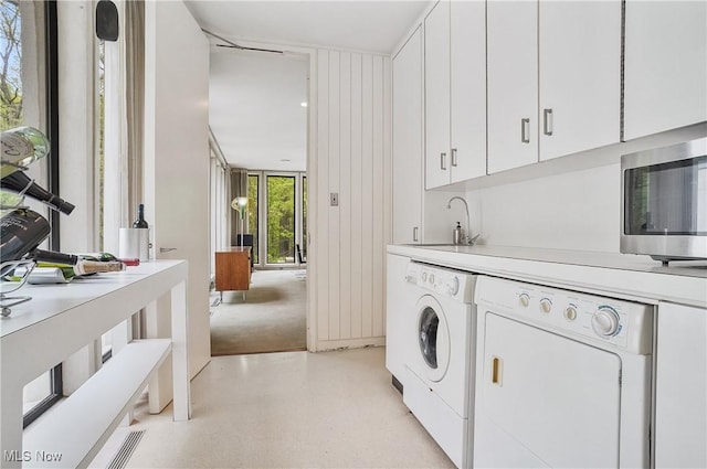 3210 N Dover Rd, Silver Lake, OH 44224 - laundry room with separate washer and dryer and cabinet space