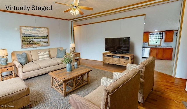728 Rising Sun Ridge Rd, Walker, WV 26180 - living room featuring wood finished floors, ceiling fan, and crown molding