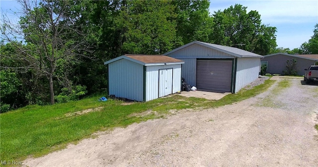 728 Rising Sun Ridge Rd, Walker, WV 26180 - detached garage with dirt driveway