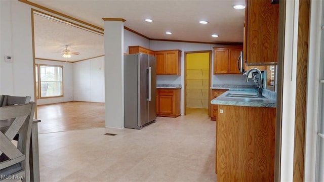728 Rising Sun Ridge Rd, Walker, WV 26180 - kitchen with high quality fridge, crown molding, a sink, brown cabinets, and light flooring