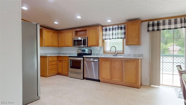 728 Rising Sun Ridge Rd, Walker, WV 26180 - kitchen featuring appliances with stainless steel finishes, a sink, light countertops, recessed lighting, and brown cabinets