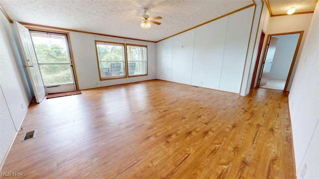 728 Rising Sun Ridge Rd, Walker, WV 26180 - unfurnished room featuring ornamental molding, light wood finished floors, a ceiling fan, and a textured ceiling