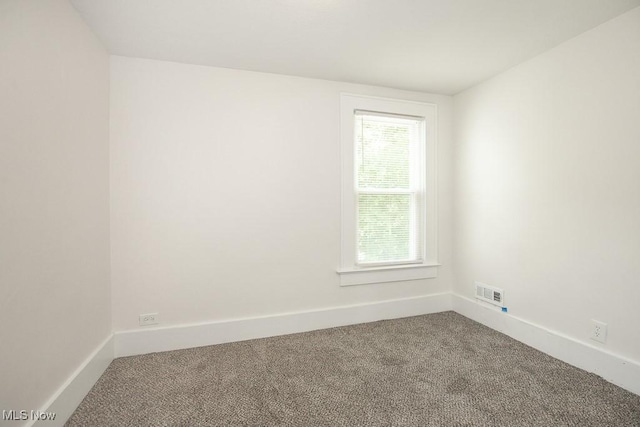1197 E Ave, Akron, OH 44307 - empty room with carpet flooring and baseboards
