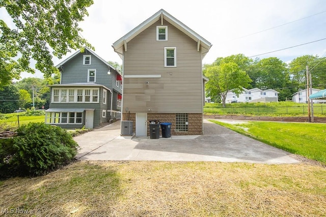 1197 E Ave, Akron, OH 44307 - rear view of house featuring a patio area and cooling unit