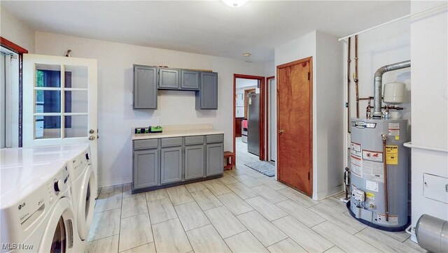 891 Sovereign Rd, Akron, OH 44303 - kitchen with washer and dryer, gas water heater, gray cabinets, and light countertops